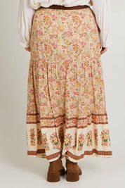 Model Laura wearing size 14 of the Chasing Sunsets Skirt in colour Bonefleur, from the back