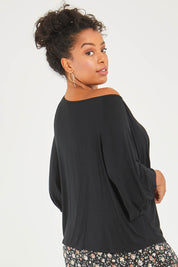 Model Noli wearing size 14 of the Softly Swinging Balloon Sleeve Tee in colour Black (Black), from the back