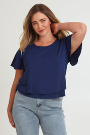 Model Chanel wearing size 16 of the Short And Sweet Bamboo Layered Tee in colour Navy (Blue), from the front, cropped image