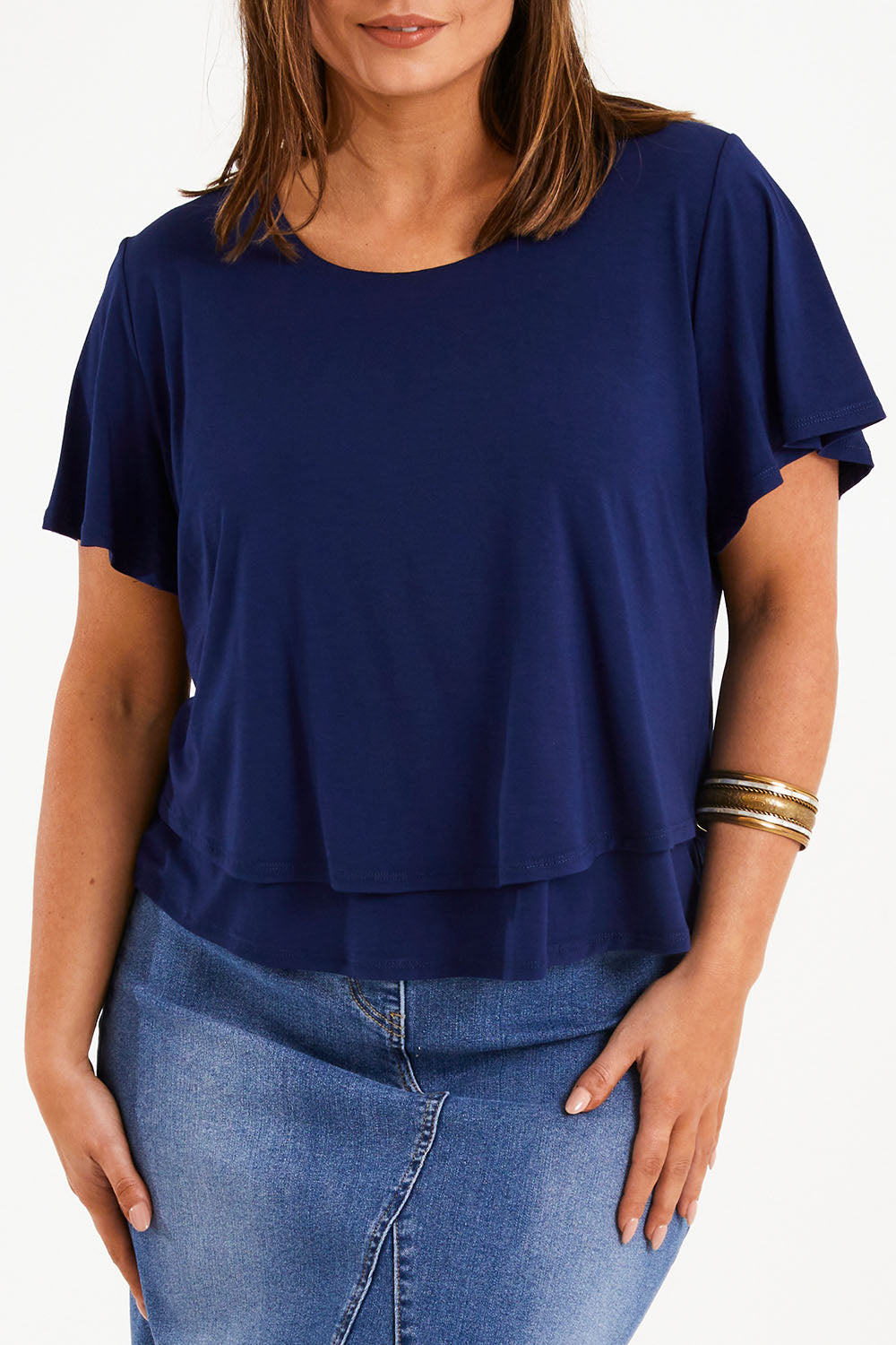 Model Monique wearing size 14 of the Short And Sweet Bamboo Layered Tee in colour Navy (Blue), from the front, cropped image