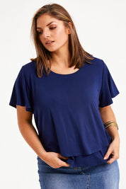 Model Monique wearing size 14 of the Short And Sweet Bamboo Layered Tee in colour Navy (Blue), from the front, cropped image
