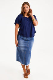 Model Monique wearing size 14 of the Short And Sweet Bamboo Layered Tee in colour Navy (Blue), from the front, showing the whole outfit