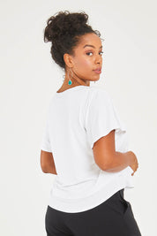 Model Noli wearing size 14 of the Short And Sweet Bamboo Layered Tee in colour White (White), from the back
