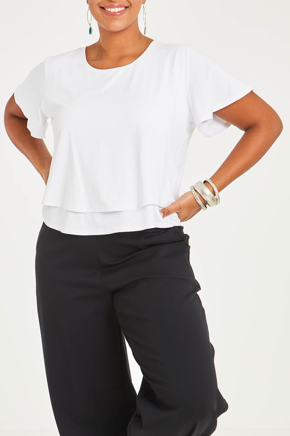 Model Noli wearing size 14 of the Short And Sweet Bamboo Layered Tee in colour White (White), from the front, cropped image