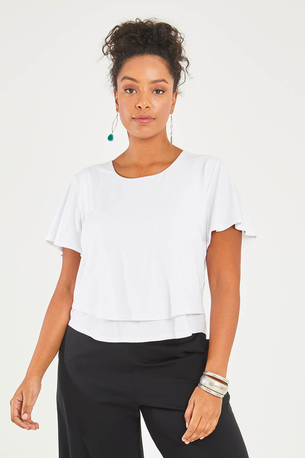 Model Noli wearing size 14 of the Short And Sweet Bamboo Layered Tee in colour White (White), from the front, cropped image