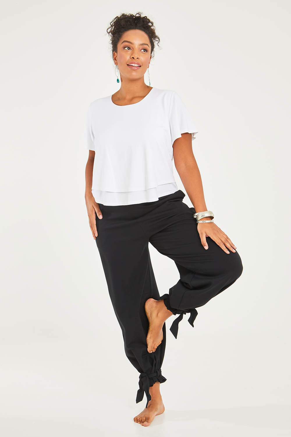 Model Noli wearing size 14 of the Short And Sweet Bamboo Layered Tee in colour White (White), from the front, showing the whole outfit