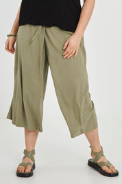 Model Keeara wearing size 16 of the Thats A Wrap Front Pants in colour Khaki (Green), from the front, cropped image