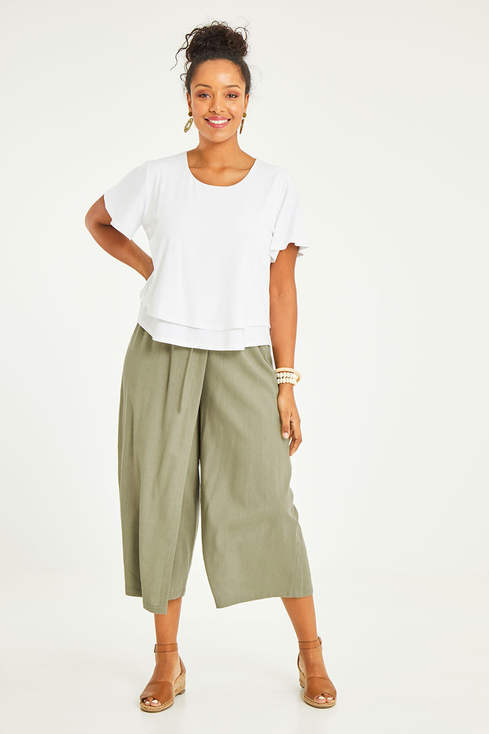 Model Noli wearing size 14 of the Thats A Wrap Front Pants in colour Khaki (Green), from the front, showing the whole outfit