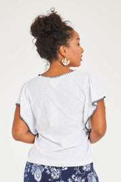 Model Noli wearing size 14 of the Blanket Stitch Butterfly Top in colour White (White), from the back