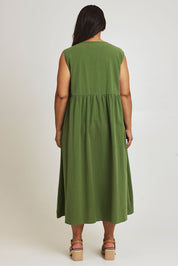 Model Ashleigh wearing size 16 of the A Cloudless Day Dress in colour Fern (Green), from the back