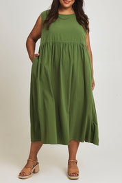 Model Ashleigh wearing size 16 of the A Cloudless Day Dress in colour Fern (Green), from the front, cropped image