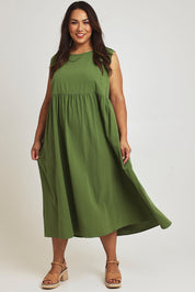 Model Ashleigh wearing size 16 of the A Cloudless Day Dress in colour Fern (Green), from the front, showing the whole outfit