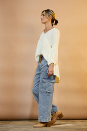 Model Tegan wearing size 10 of the Chasing After You Cargo Jeans in colour Denim (Blue), from the front, showing the whole outfit