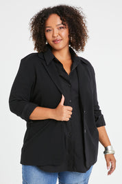 Model Alexis wearing size 16 of the Keeping It Cool Oversized Boyfriend Blazer in colour Black (Black), from the front, cropped image