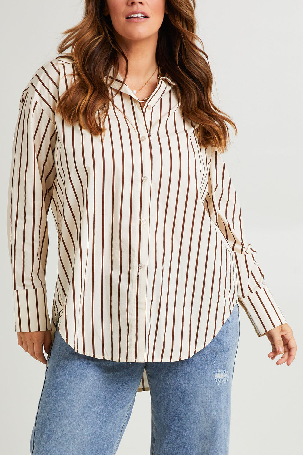 Model Laura wearing size 14 of the Relaxed Elegance Boyfriend Shirt in colour Chocstripe, from the front, cropped image