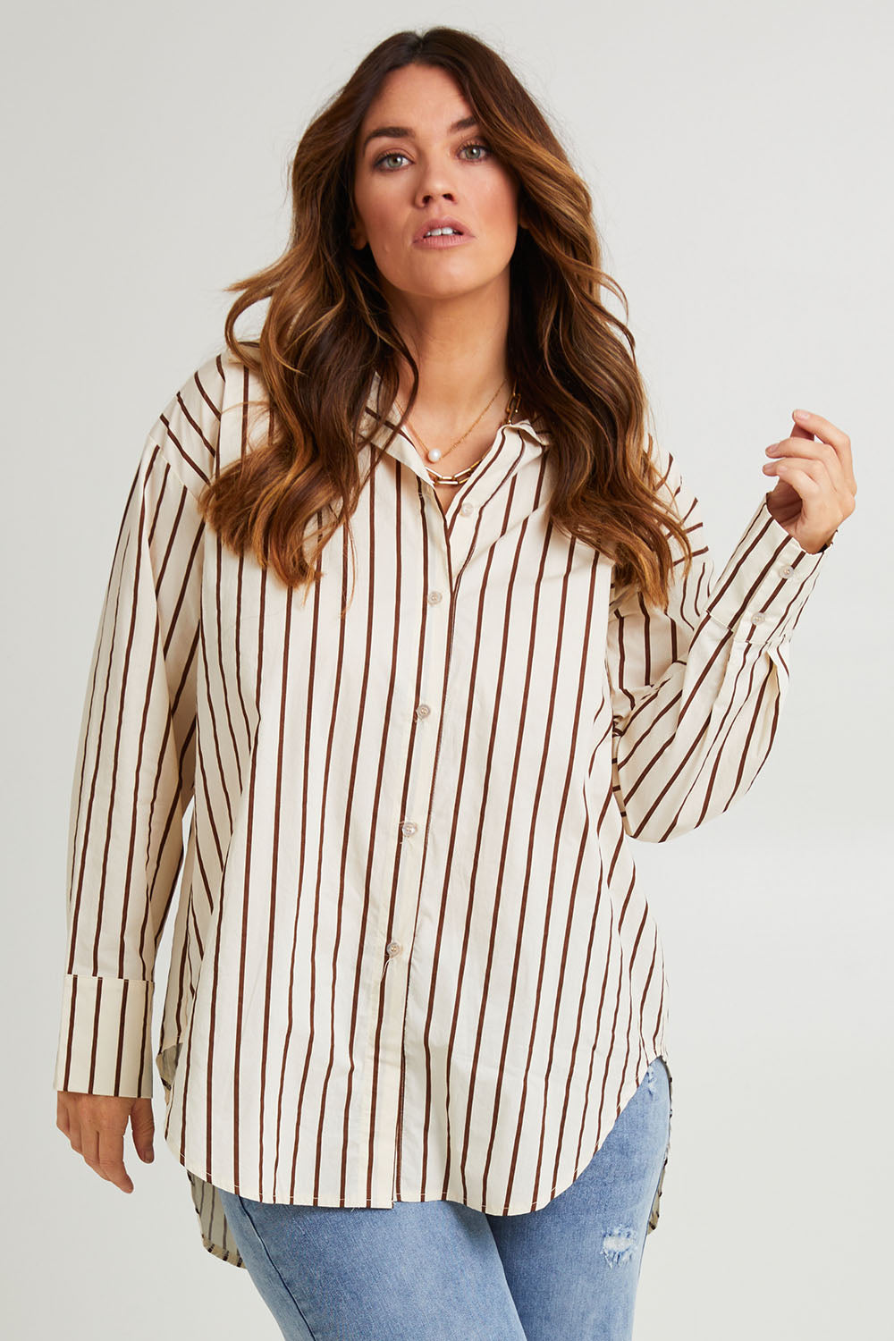 Model Laura wearing size 14 of the Relaxed Elegance Boyfriend Shirt in colour Chocstripe, from the front, cropped image