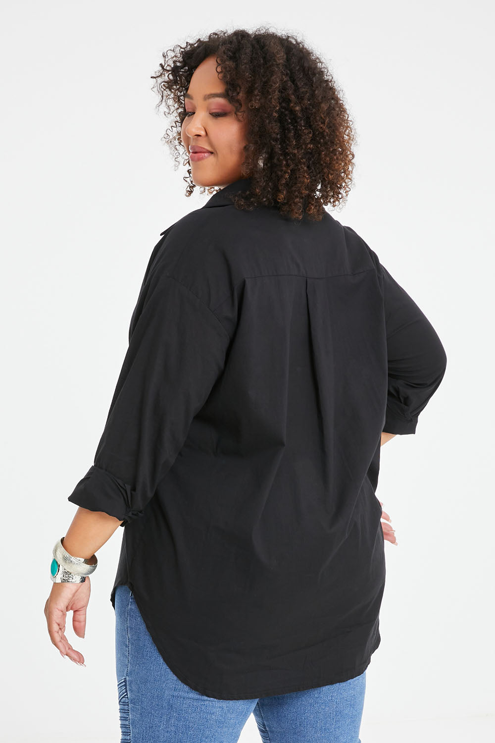 Model Alexis wearing size 16 of the Relaxed Elegance Boyfriend Shirt in colour Black (Black), from the back