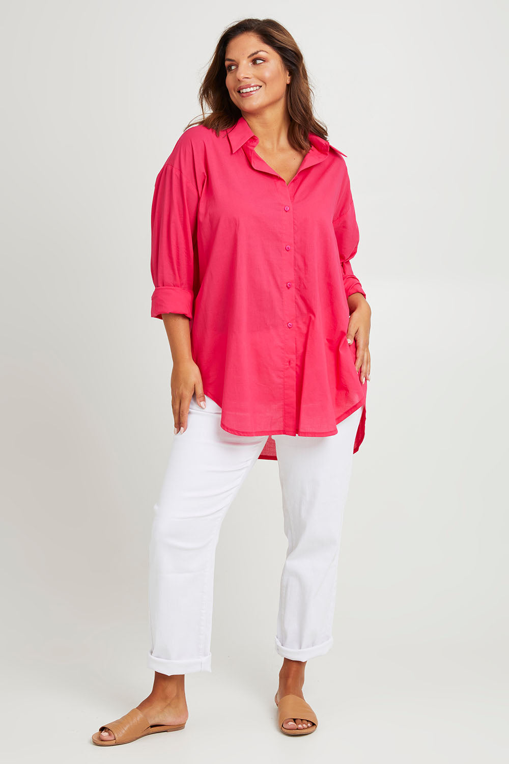 Model Monique wearing size 14 of the Relaxed Elegance Boyfriend Shirt in colour Hotpink (Pink), from the front, showing the whole outfit