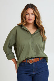 Model Laura wearing size 14 of the Relaxed Elegance Boyfriend Shirt in colour Khaki (Green), from the front, cropped image