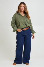 Model Laura wearing size 14 of the Relaxed Elegance Boyfriend Shirt in colour Khaki (Green), from the front, showing the whole outfit