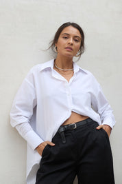 Model Tahnee wearing size 10 of the Relaxed Elegance Boyfriend Shirt in colour White (White), from the front, showing the whole outfit