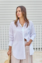 Model Tegand wearing size 10 of the Relaxed Elegance Cotton Boyfriend Shirt - White in colour White, from an angle