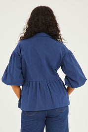 Model Noli wearing size 14 of the Daydreaming Billow Sleeve Shirt in colour Blue (Blue), from the back