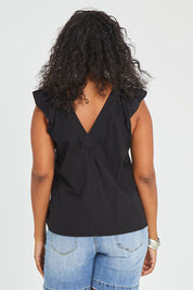 Model Noli wearing size 14 of the Frill Me Cotton Top in colour Black (Black), from the back