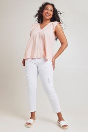 Model Terri-Leigh wearing size 14 of the Frill Me Cotton Top in colour Petal (Pink), from the front, showing the whole outfit