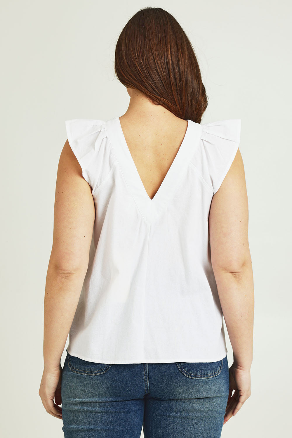 Model Jane wearing size 14 of the Frill Me Cotton Top in colour White (White), from the back