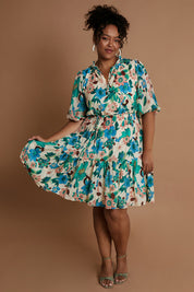 Model Alexis wearing size 16 of the Sweet As Sugar Dress in colour Fleurblue (Blue), from the front, showing the whole outfit