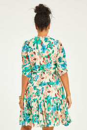 Model Noli wearing size 14 of the Sweet As Sugar Dress in colour Fleurblue (Blue), from the back