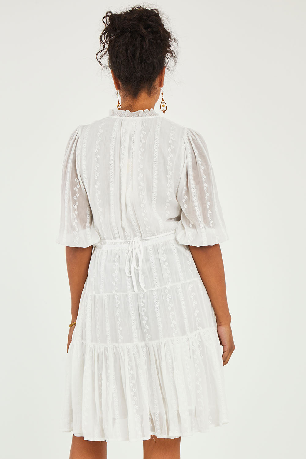 Model Noli wearing size 14 of the Sweet As Sugar Dress in colour White (White), from the back