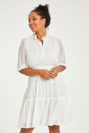 Model Noli wearing size 14 of the Sweet As Sugar Dress in colour White (White), from the front, cropped image