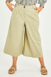 Model Terri-Leigh wearing size 14 of the Summer Breeze Boyfriend Pants in colour Khaki (Green), from the front, cropped image