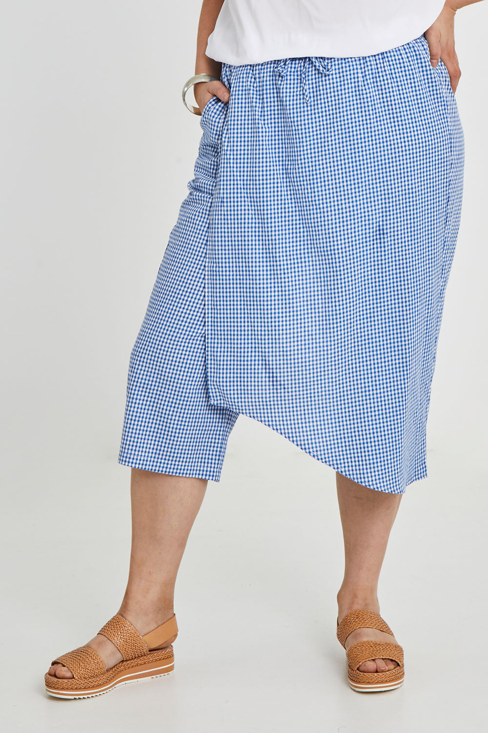 Model Keeara wearing size 16 of the Honeypie Cotton Overlay Pants in colour Blue (Blue), from the front, cropped image