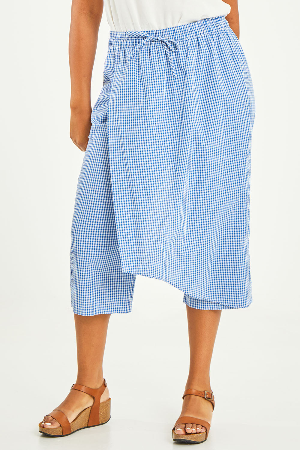 Model Noli wearing size 14 of the Honeypie Cotton Overlay Pants in colour Blue (Blue), from the front, cropped image