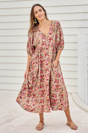Model Tegand wearing size 10 of the Summer Picnic Printed Smock Dress – Greenfleur in colour Greenfleur, from the front