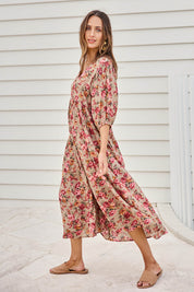 Model Tegand wearing size 10 of the Summer Picnic Printed Smock Dress – Greenfleur in colour Greenfleur, from the front