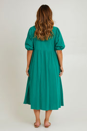 Model Laura wearing size 14 of the Summer Picnic Smock Dress in colour Springreen (Green), from the back