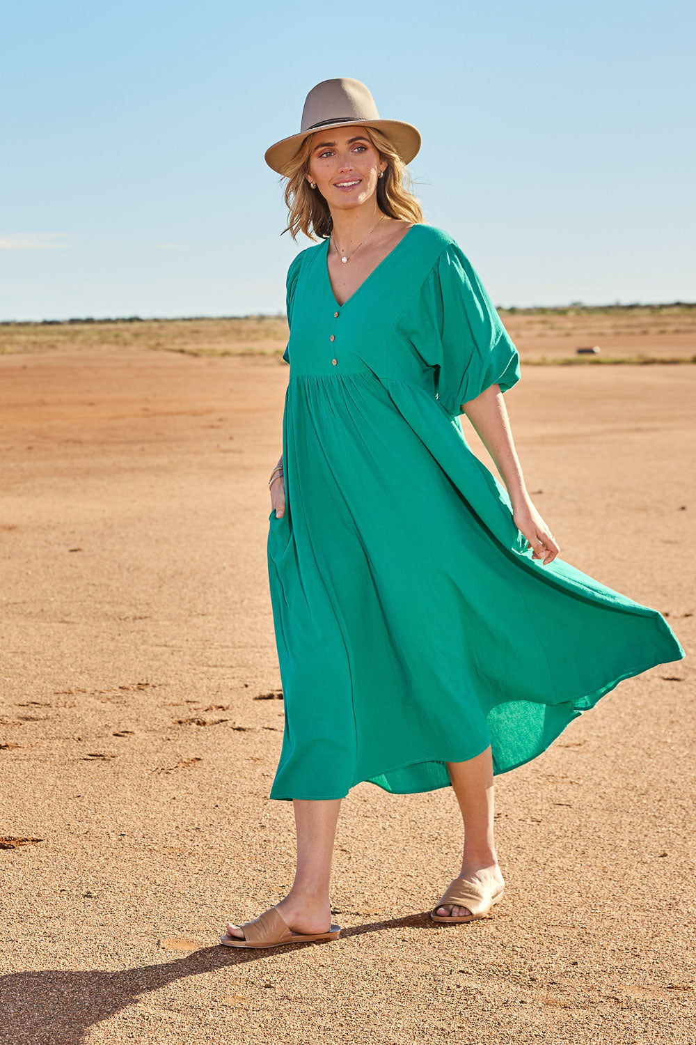 Model Tegan wearing size 10 of the Summer Picnic Smock Dress in colour Springreen (Green), from the front, showing the whole outfit