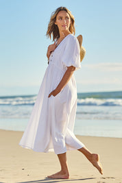 Model Tegan wearing size 10 of the Summer Picnic Smock Dress in colour White (White), from the front, showing the whole outfit