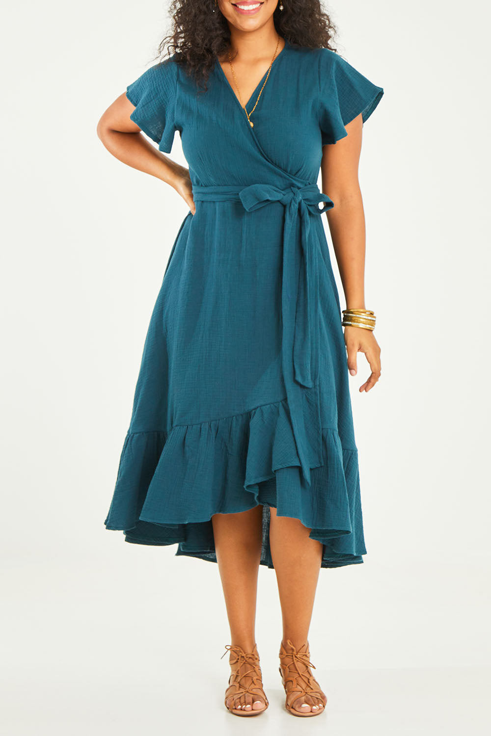 Model Noli wearing size 14 of the Thats A Wrap Organic Cotton Dress in colour Lagoon (Blue), from the front, cropped image