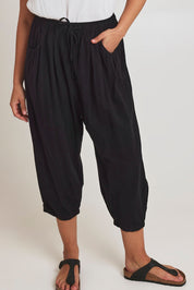 Model Terri-Leigh wearing size 14 of the Beach Stroll Cotton Pants in colour Black (Black), from the front, cropped image