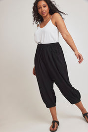 Model Terri-Leigh wearing size 14 of the Beach Stroll Cotton Pants in colour Black (Black), from the front, showing the whole outfit