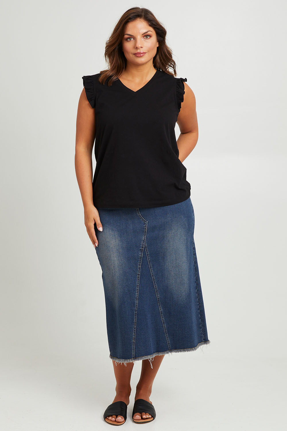 Model Monique wearing size 14 of the Easy As Pull On Denim Skirt in colour Darkdenim (Blue), from the front, showing the whole outfit