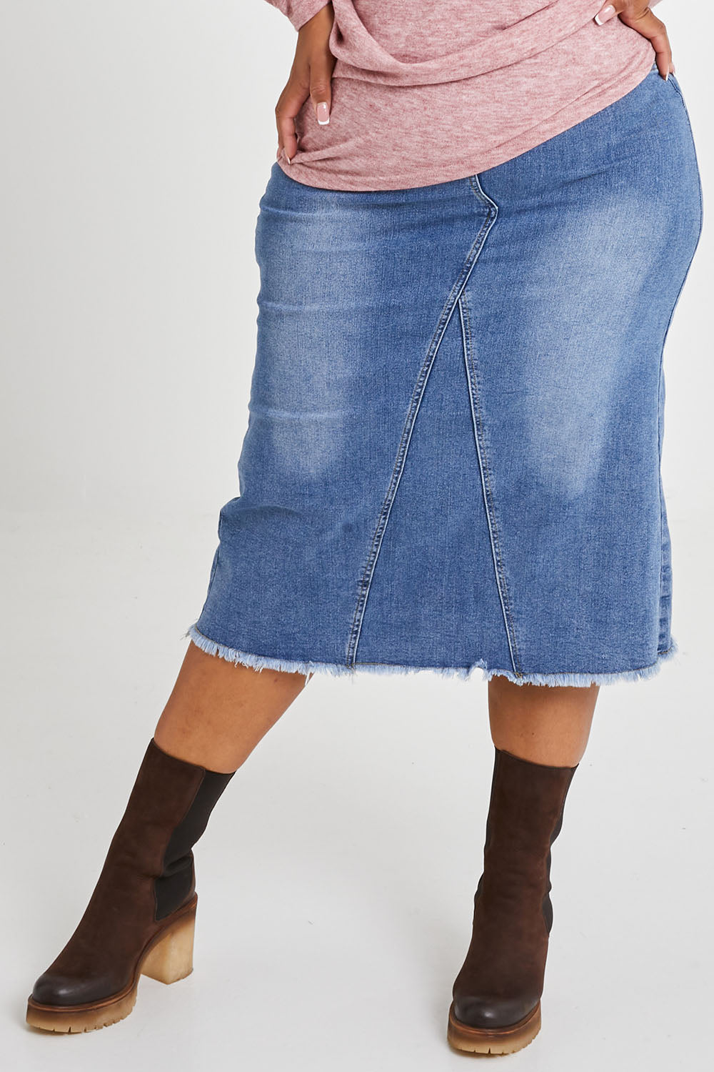 Model Alexis wearing size 16 of the Easy As Pull On Denim Skirt in colour Denim (Blue), from the front, cropped image
