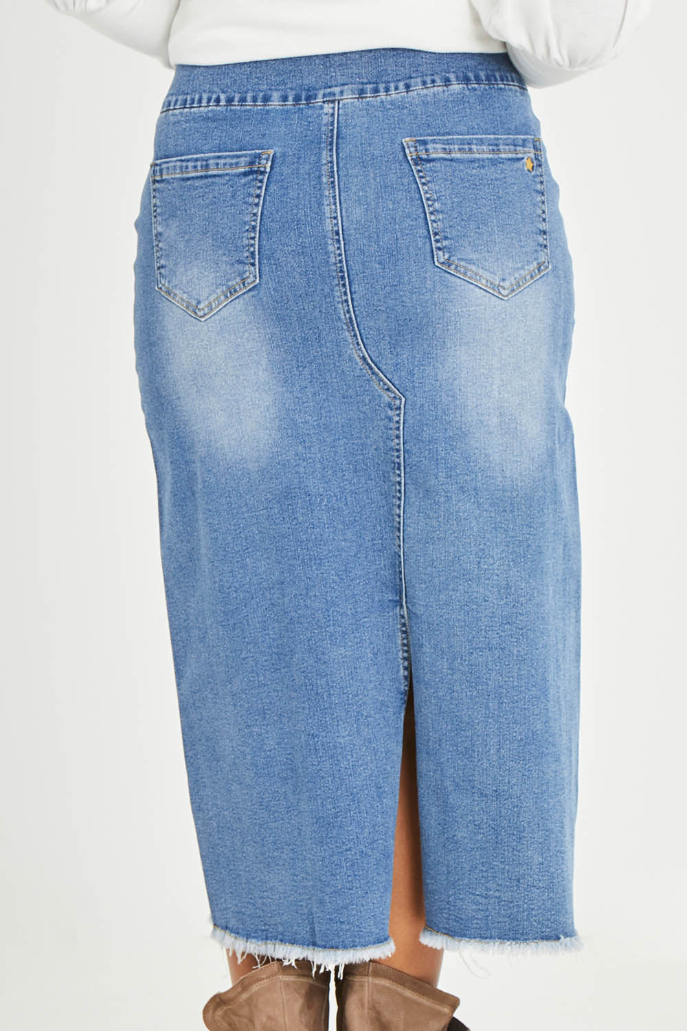 Model Noli wearing size 14 of the Easy As Pull On Denim Skirt in colour Denim (Blue), from the back