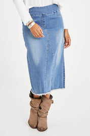Model Noli wearing size 14 of the Easy As Pull On Denim Skirt in colour Denim (Blue), from the front, cropped image