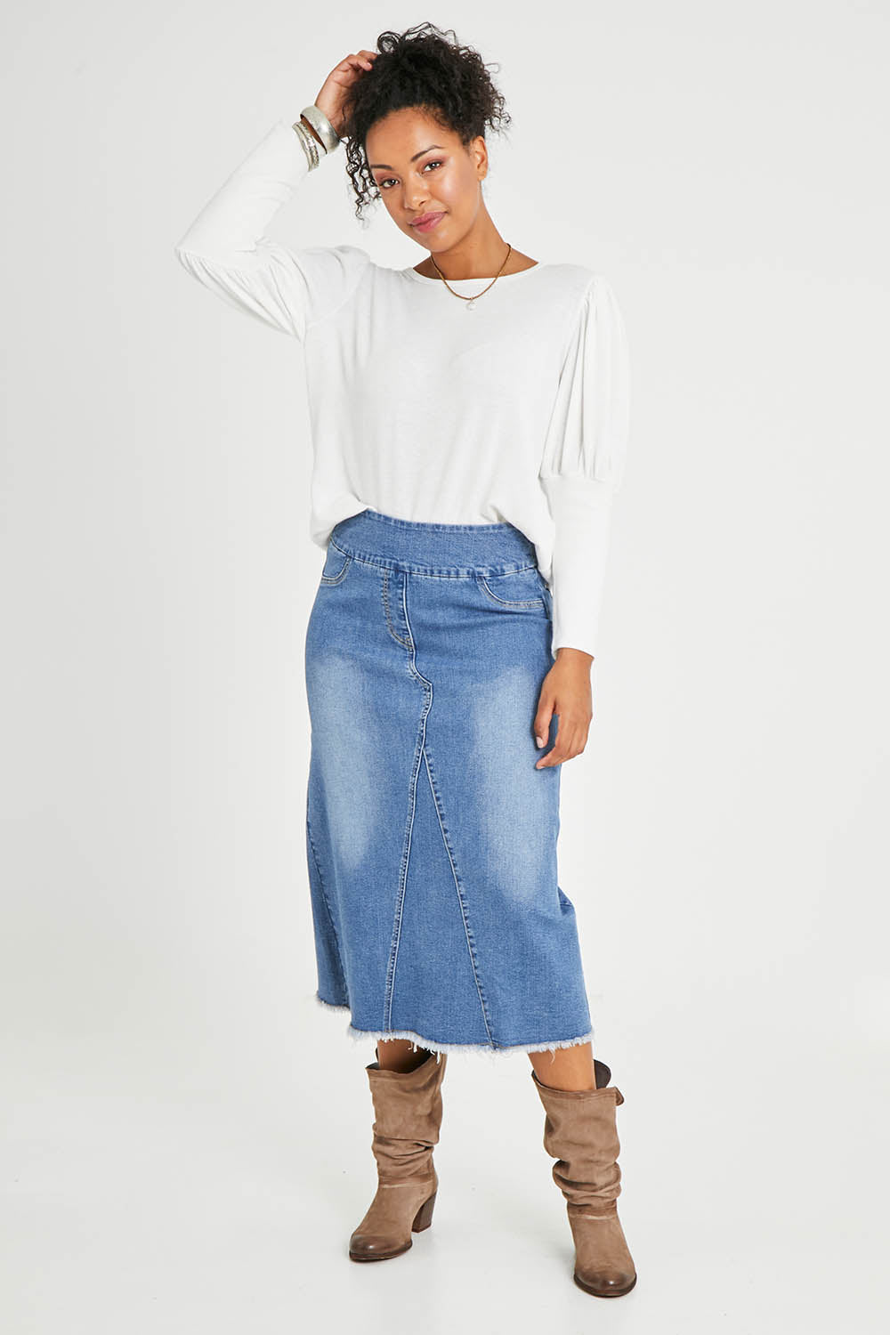Model Noli wearing size 14 of the Easy As Pull On Denim Skirt in colour Denim (Blue), from the front, showing the whole outfit